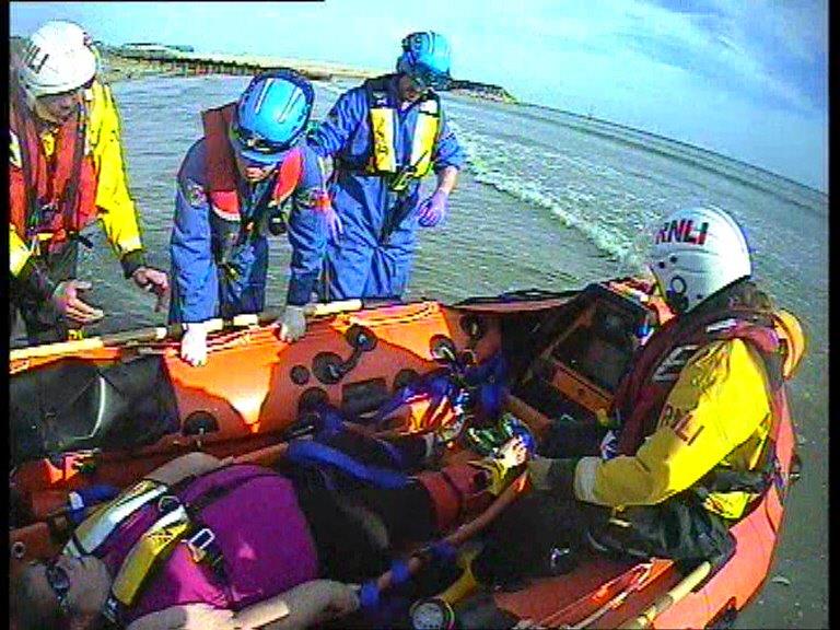 Evacuation of injured woman